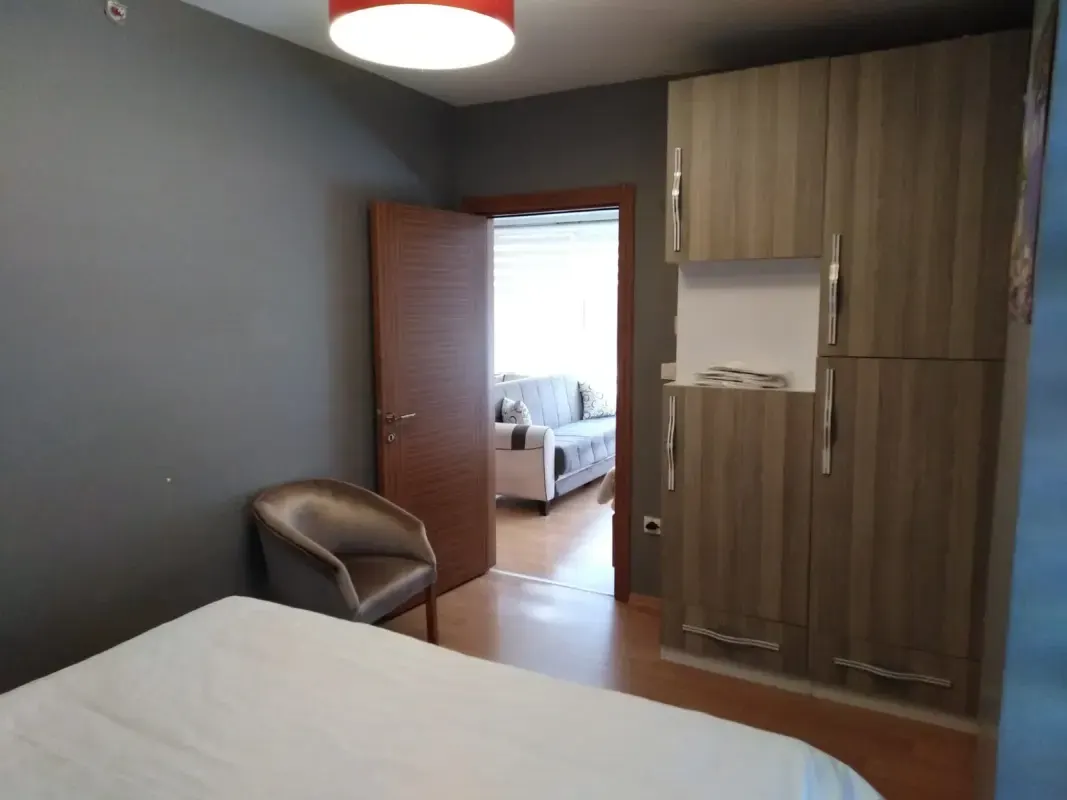 Master bedroom with large wooden wardrobe