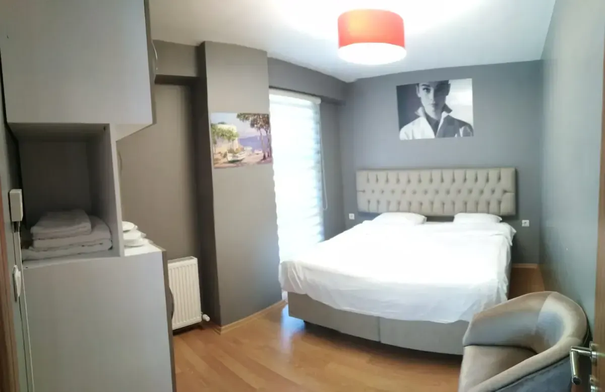 Bedroom with double bed and warm lighting with balcony