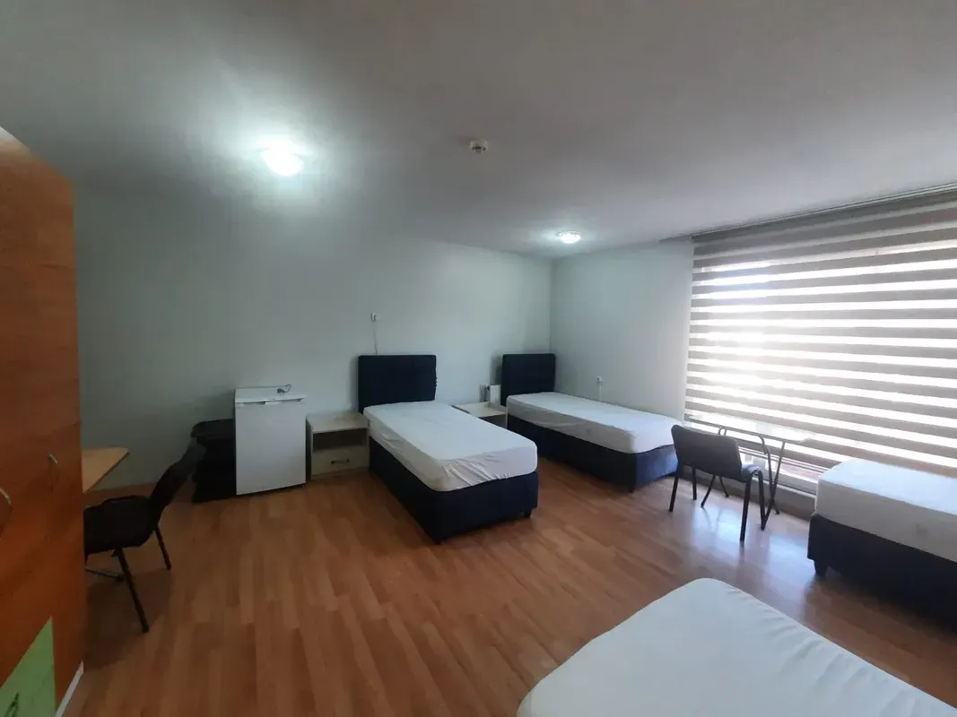 Spacious double room with comfortable beds and wardrobes in Academia residence