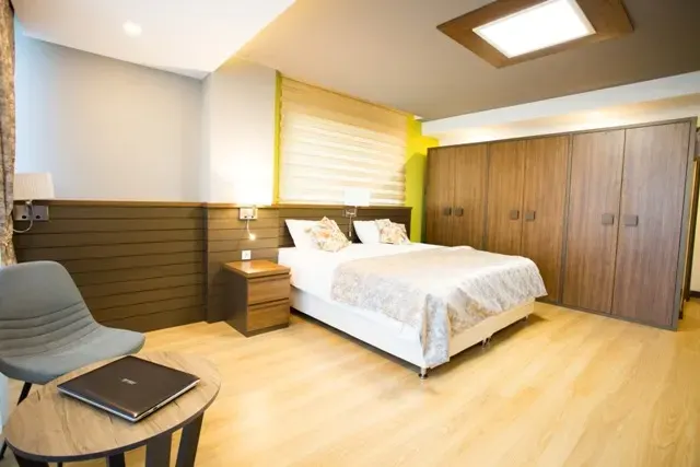 Single bedroom with study desk and TV