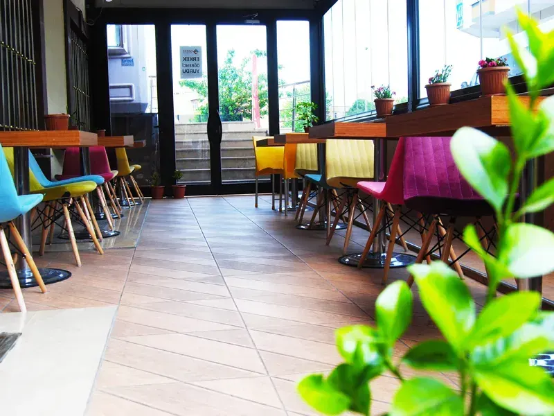 Shared lounge with colorful chairs in student residence