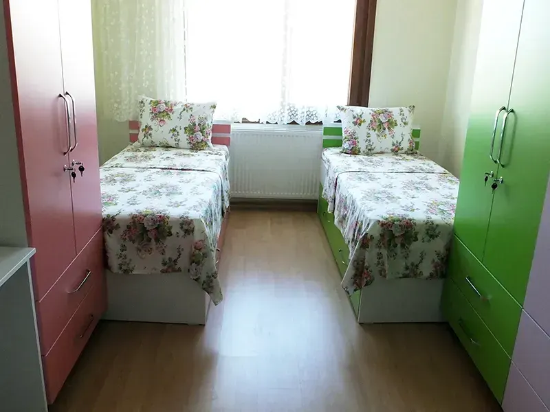 Double room with colorful walls in student residence