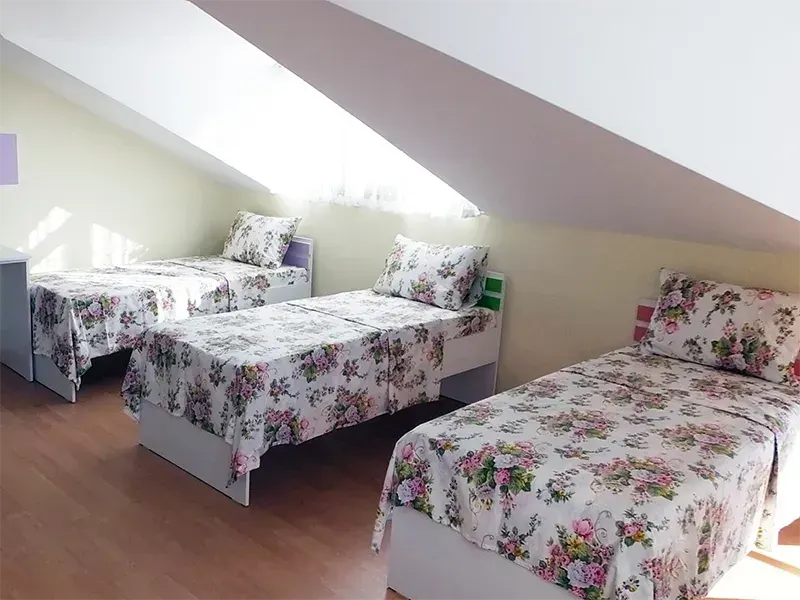 Attic (mansard) room with comfortable beds on the top floor