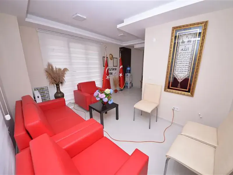 Living room with red sofa in female student residence